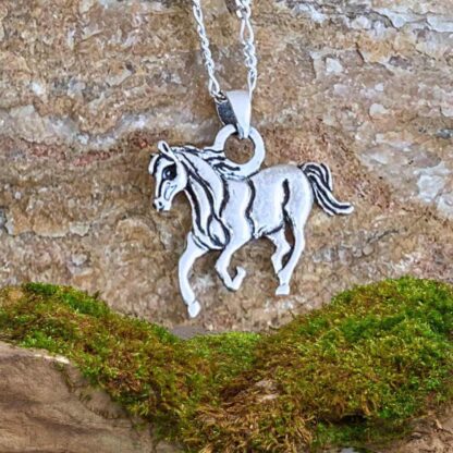 an image of a Sterling Silver Horse Pendant showing one eye as it runs towards you
