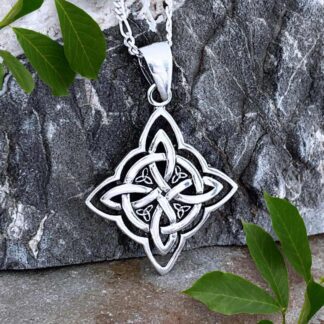 an image of a Sterling Silver Celtic Knot Pendant with four small Celtic Triquetra Knots working around the center. Total pendant height is 1.5 inches and is a good unisex pendant
