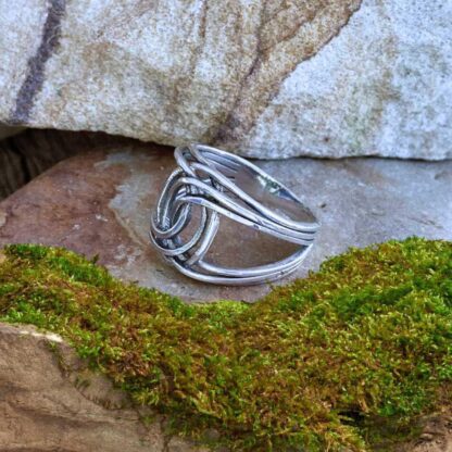 an image of a side view of a an image of a sterling silver double twisted knot ring