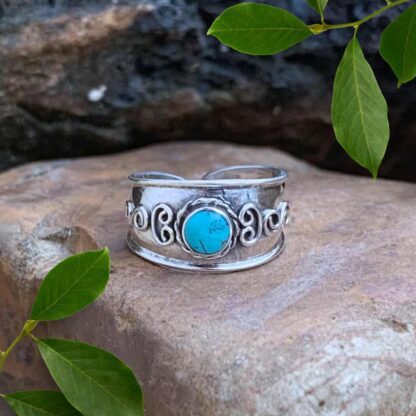 an image of a sterling silver Bali Toe Ring with a round turquoise gemstone. Face height is 8.2 mm