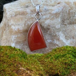 an image of a unique geometric shaped carnelian pendant set in sterling silver with a 1.29 inch drop