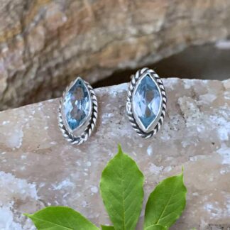 An image of a pair of Marquise Blue Topaz and Sterling Silver Stud Earrings