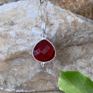 an image of a Petite Faceted Garnet and Sterling Silver Pendant