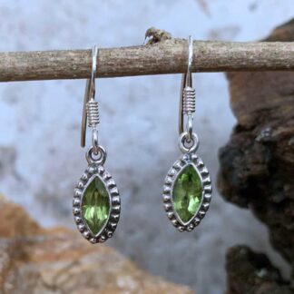 an image of a pair of Marquise Peridot and Sterling Silver Dangly Earrings with dimensions of 28 mm X Width: 7 mm