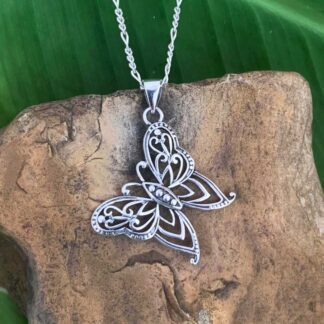 an image of a sterling silver filigree butterfly pendant that hangs at an angle.