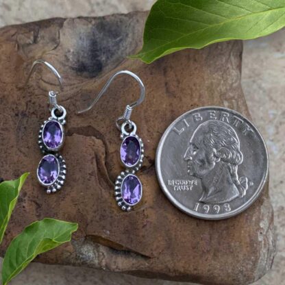 an image of a pair of Double Oval Amethyst and Sterling Silver Dangle Earrings next to a quarter