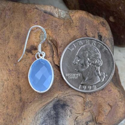 an image of a Blue Chalcedony and Sterling Silver Oval Earring next to a quarter