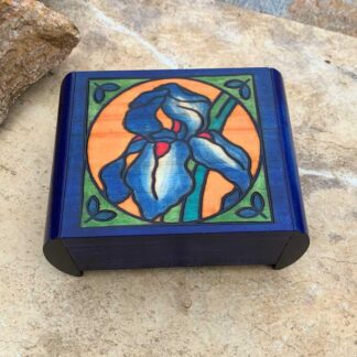 an image of a Handcrafted Secret Locking Iris Box that is blue with an iris flower in a circle on the front and measures 6.00 x 4.68 x 2.50 inches