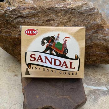 an image of a box of Woody Sandalwood Incense Cones by HEM company with 10 cones in each box