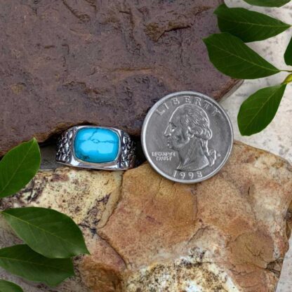 an image of a Sterling Silver Nugget and Rectangular Turquoise Gemstone Ring next to a quarter