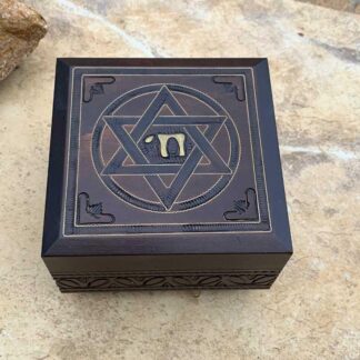 An image of a dark brown handcrafted wood box with a Star of David on the top and the word Chai in the center of the star. Dimensions are 4.75 x 4.75 x 3.00 inches