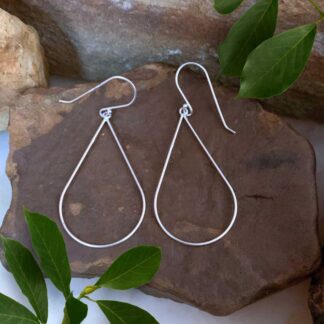 an image of a pair of Simple Sterling Silver Pear Shaped Dangle Earrings that are 1.5 inches long.