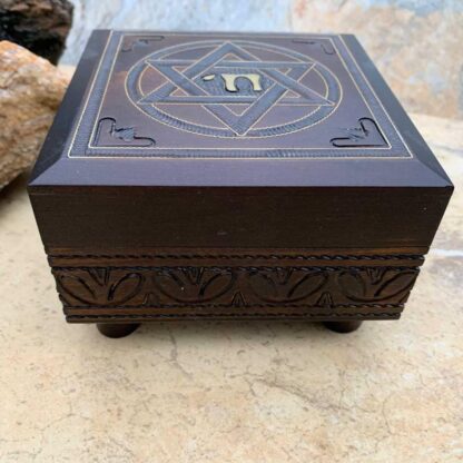 An image of a dark brown handcrafted wood box with a Star of David on the top and the word Chai in the center of the star. Dimensions are 4.75 x 4.75 x 3.00 inches