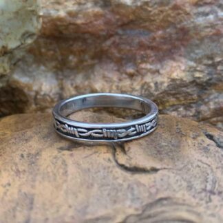 an image of a sterling silver band stye ring with a barbed wire pattern that wraps around