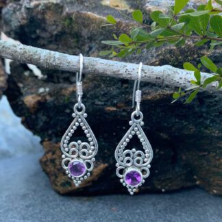 an image of a pair of sterling silver upside down open heart earrings with a faceted amethyst gemstone at the bottom