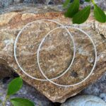 an image of a pair of Simple Sterling Silver Two Inch Continuous Hoop Earrings