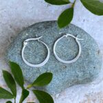 an image of a pair of Sterling Silver Graduated Circle Click Hoop Earrings