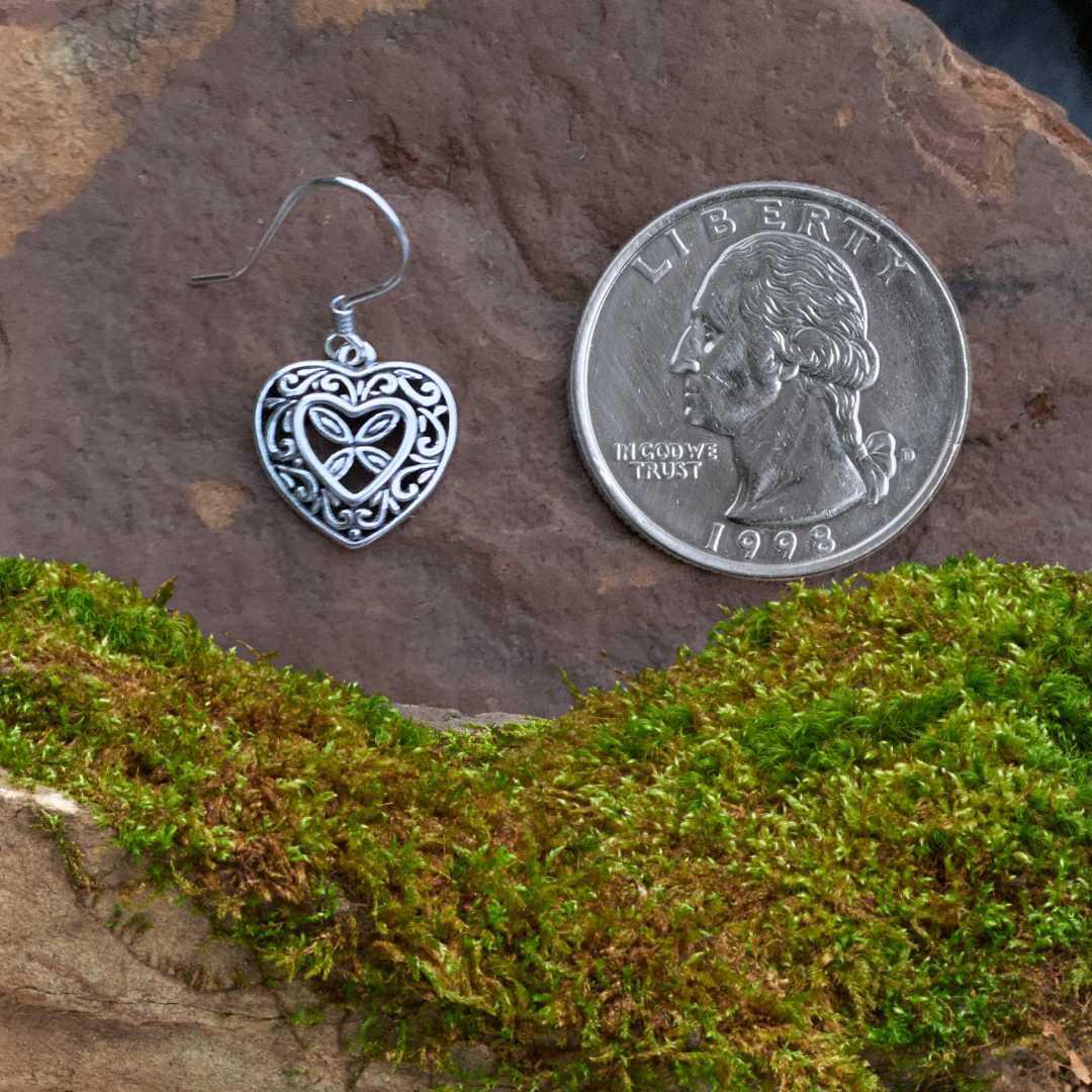 an image of a Romantic Filigree Heart Sterling Silver Earring next to a quarter