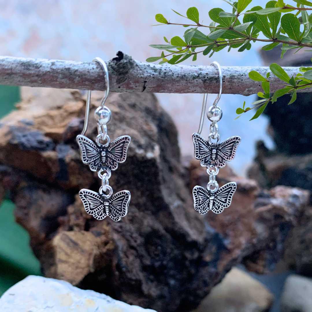 an image of a lightweight pair of Oxidized Sterling Silver Double Butterfly Dangle Earrings