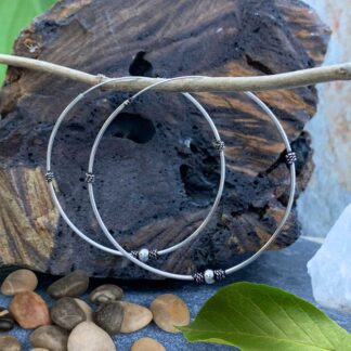 an image of a pair of very Large Sterling Silver Bali Continuous Hoop Earrings with a silver ball at bottom of each hoop
