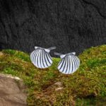 an image of a pair of detailed Sterling Silver Scalloped Seashell Stud Earrings that have a face height of .35 inches