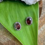 an image of a pair of oval Faceted Garnet and Sterling Silver Stud Earrings