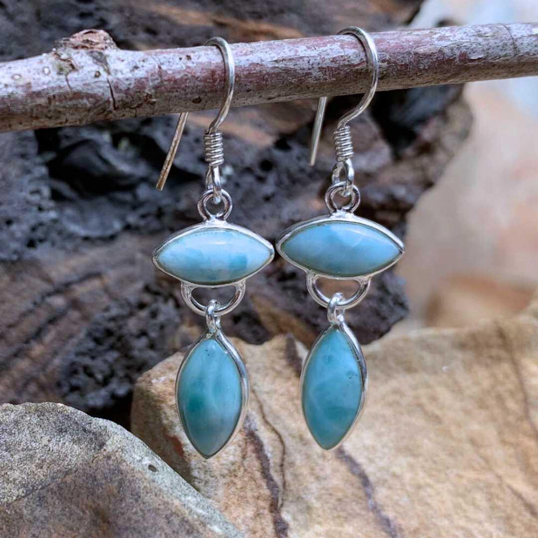 an image of a pair of Larimar and Sterling Silver Dangle Earrings with two marquise cut stones with one going sideways and one vertical