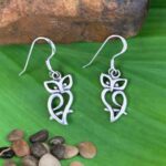 an image of an open silhouette style of owl dangle earrings