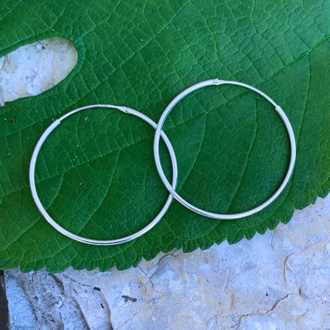 an image of a pair of Sterling Silver 1.4 inch Continuous Hoop Earrings