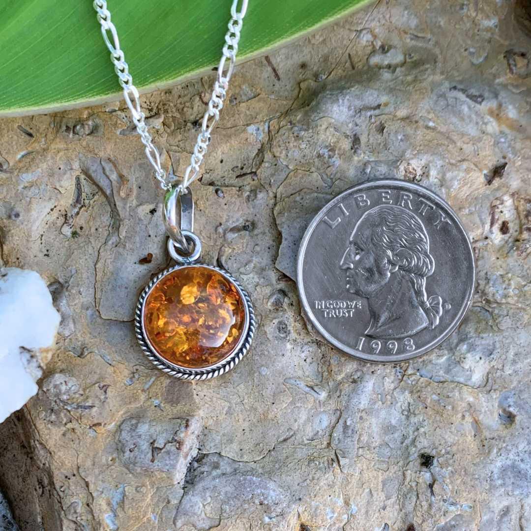 An image of a Round Amber and Sterling Silver Pendant that is .59 inches in diameter