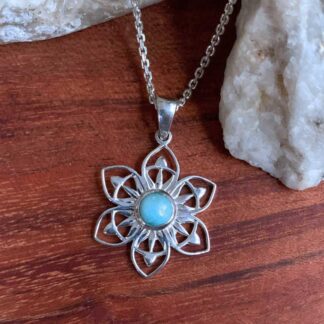 an image of a Sterling Silver Lotus with a round Larimar in the center Pendant
