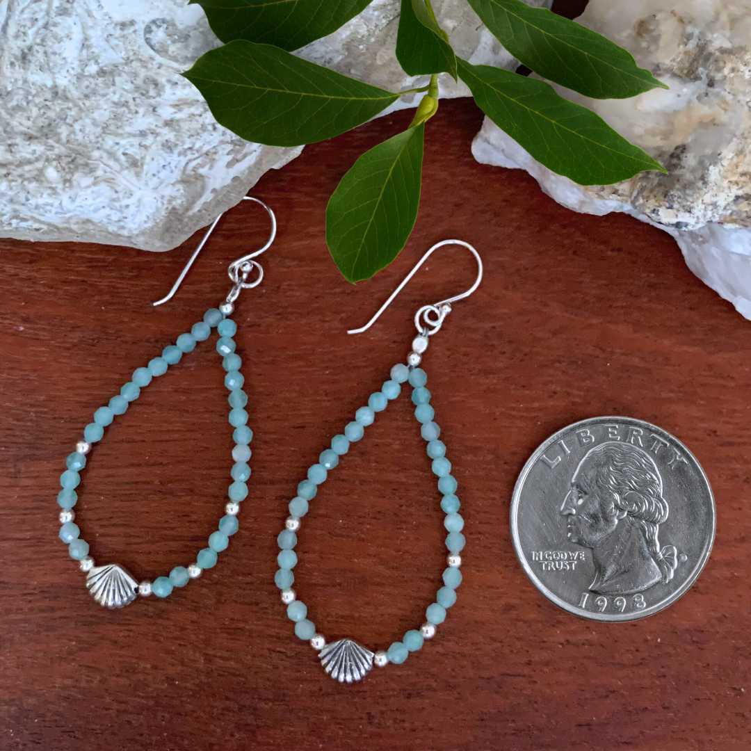 an image of a pair of Beaded Amazonite with Seashell Sterling Silver Earrings next to a quarter