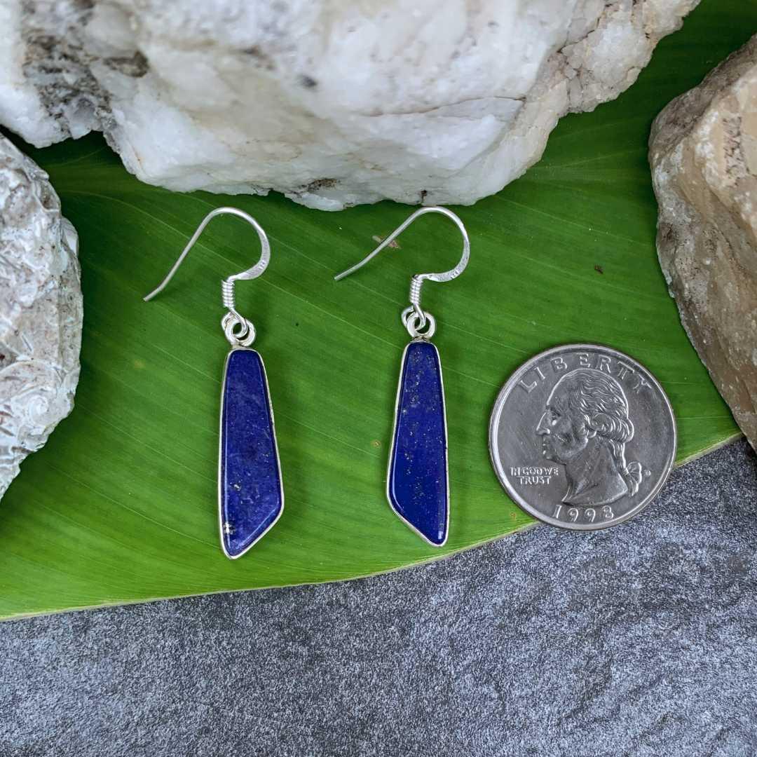 an image of a Contemporary Lapis Lazuli and Sterling Silver Dangle Earrings with an angled cut at the bottom and next to a quarter