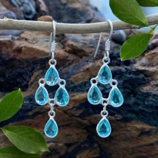 an image of a pair of Blue Topaz and Sterling Silver Chandelier Earrings with 4 teardrop shaped faceted blue topaz gemstones
