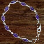 an image of a Amethyst Marquise Sterling Silver Bracelet featuring 9 marquise shaped amethyst gemstones all set in sterling silver with a sterling silver lobster clasp