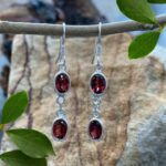an image of a pair of Double Faceted Garnet and Sterling Silver Dangle Earrings
