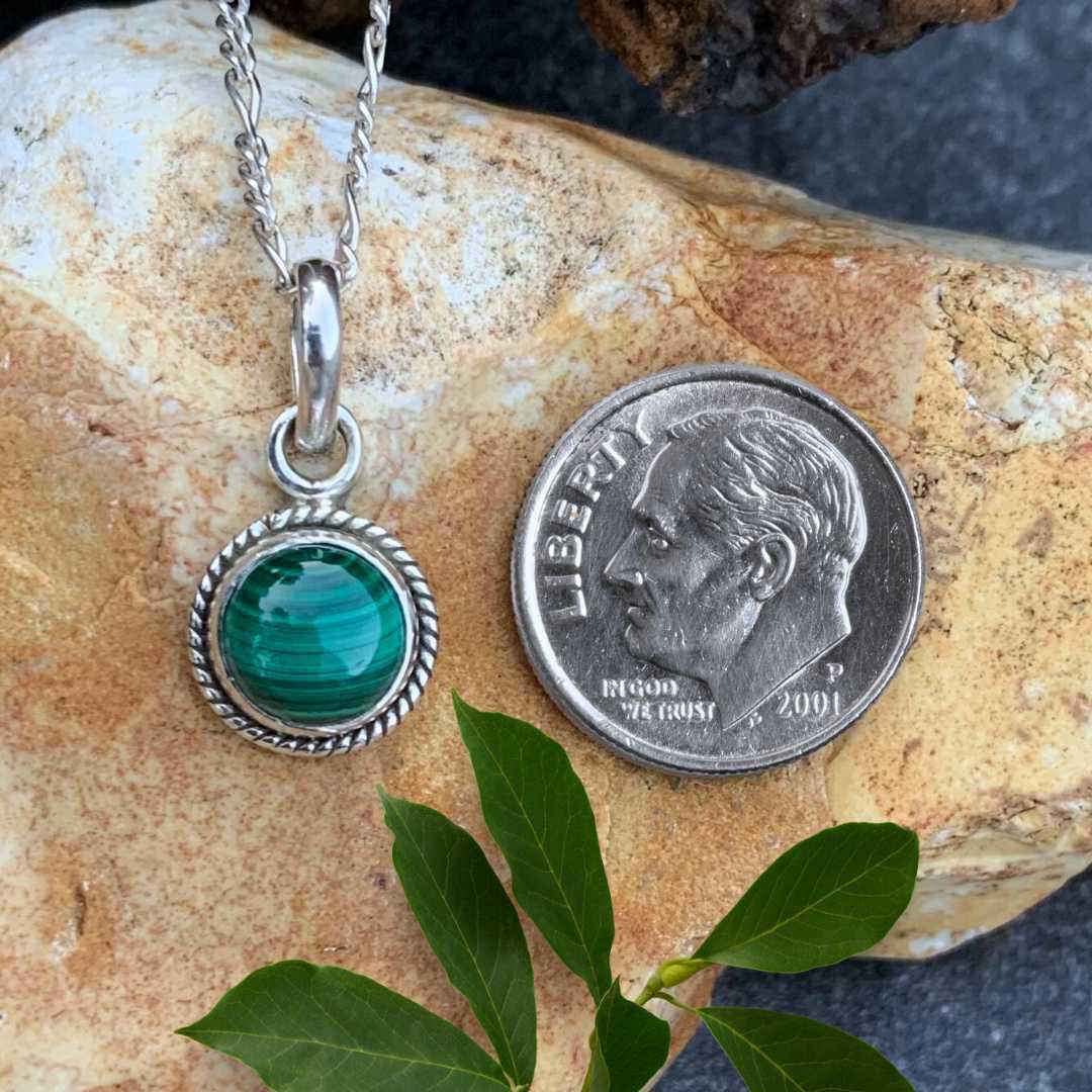 an image of a Petite Round Malachite Sterling Silver Pendant next to a dime