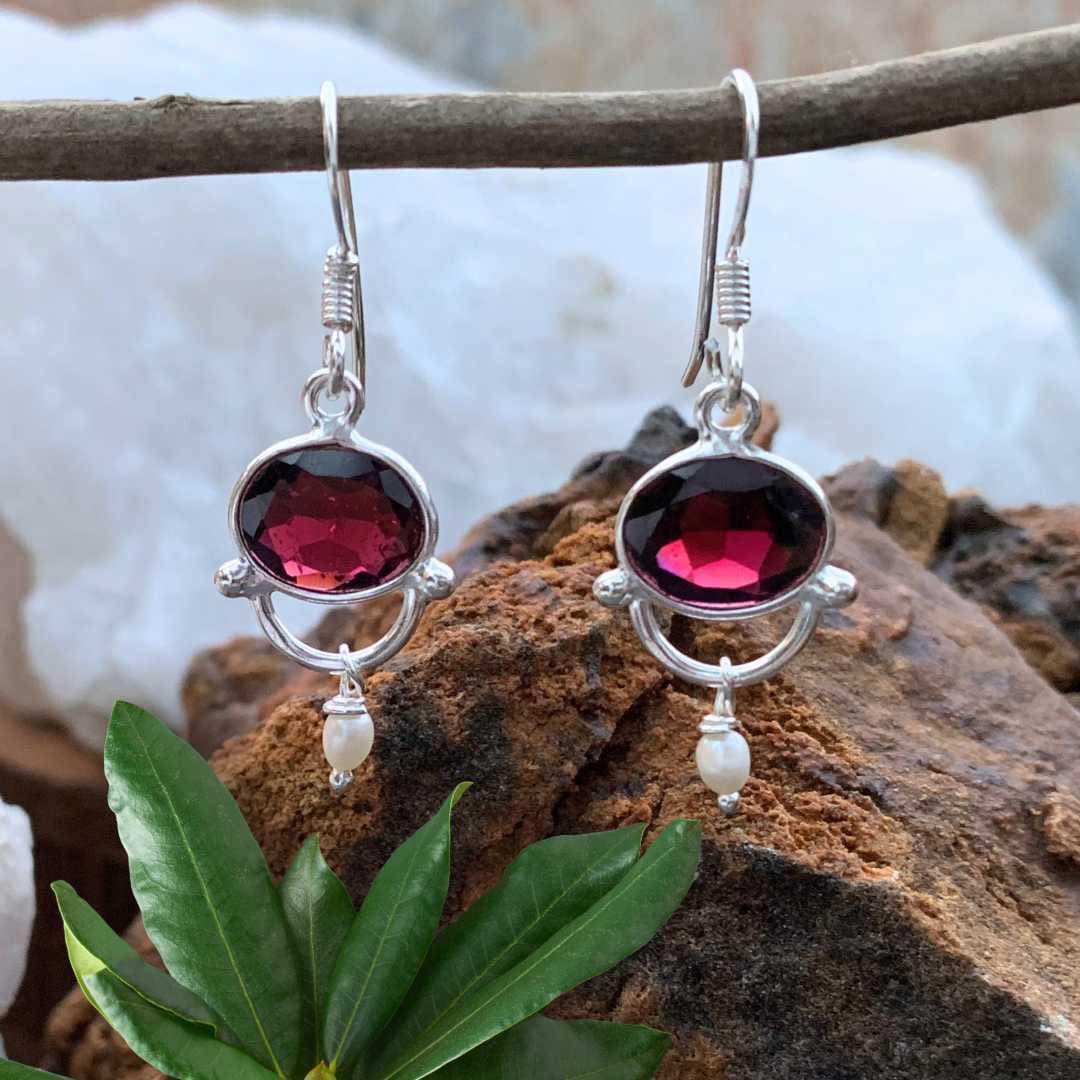 an image of a pair of Oval Garnet with tiny Pearl and Sterling Silver Earrings