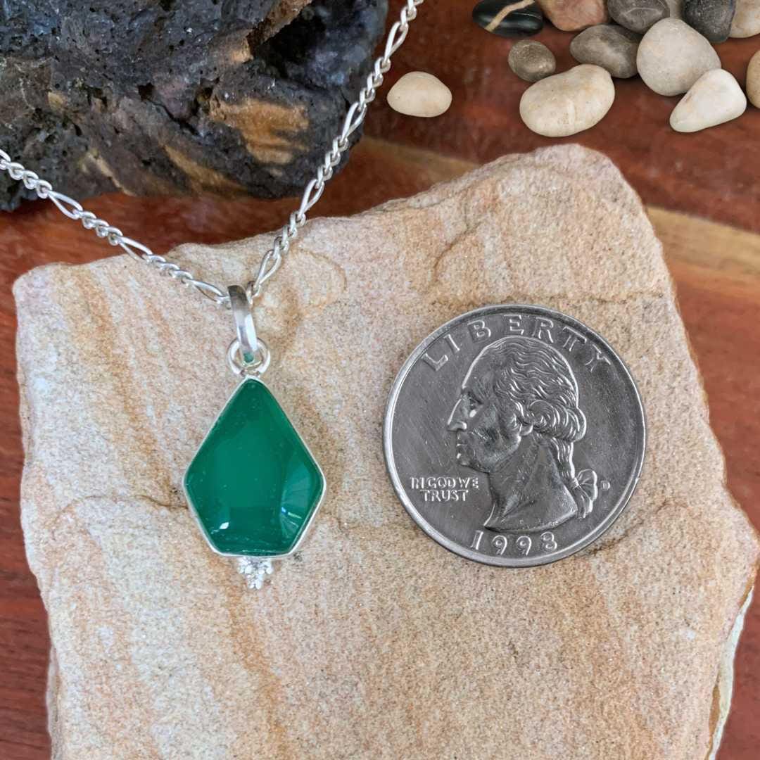 an image of a Geometric Green Onyx and Sterling Silver Pendant next to a quarter