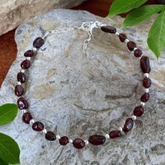 An image of a Sterling Silver and Garnet Beads Bracelet