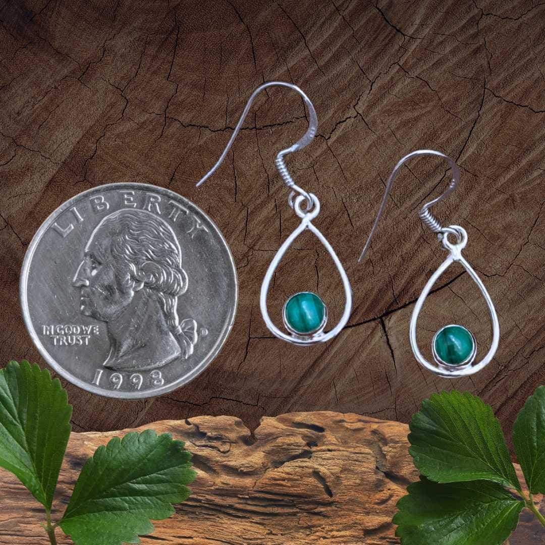 an image of a pair of Open Oval Sterling Silver and Malachite Earrings next to a quarter