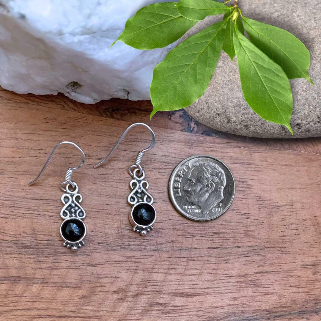an image of a Dainty Round Black Onyx and Sterling Silver Earrings next to a dime