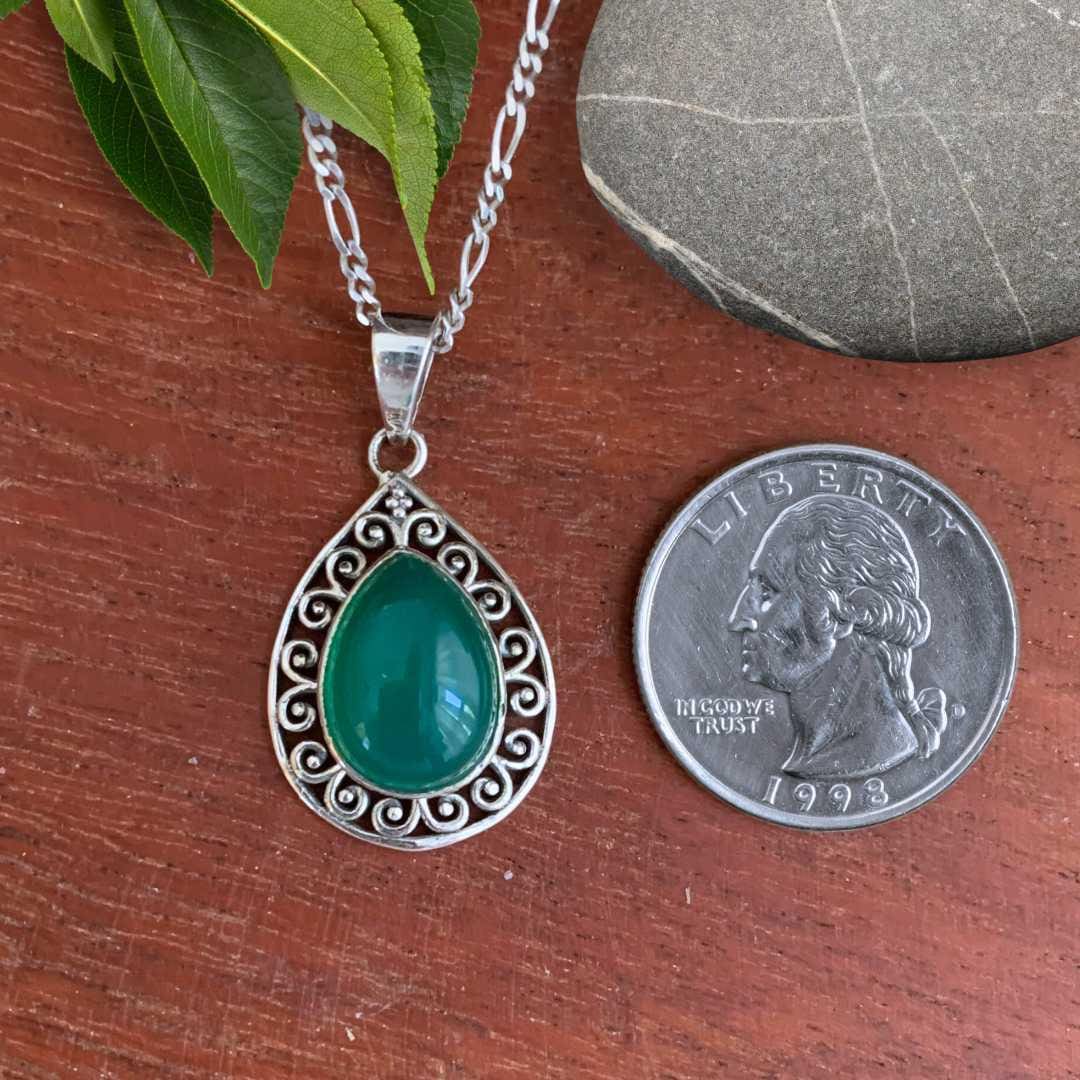 an image of a Teardrop Green Onyx Filigree Sterling Silver Pendant next to a quarter