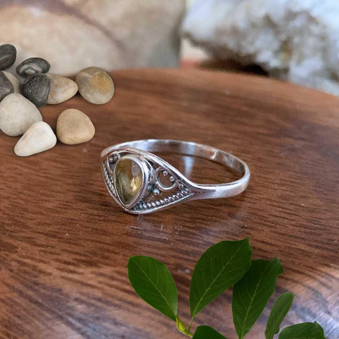 an image of a side view of a Dainty Teardrop Citrine Sterling Silver Ring