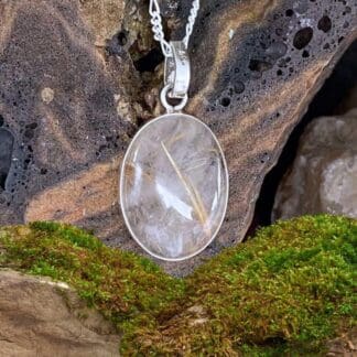 an image of an oval Golden Rutile Quartz and Sterling Silver Pendant