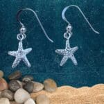 an image of a pair of dainty Starfish Sterling Silver Earrings with subtle dangle