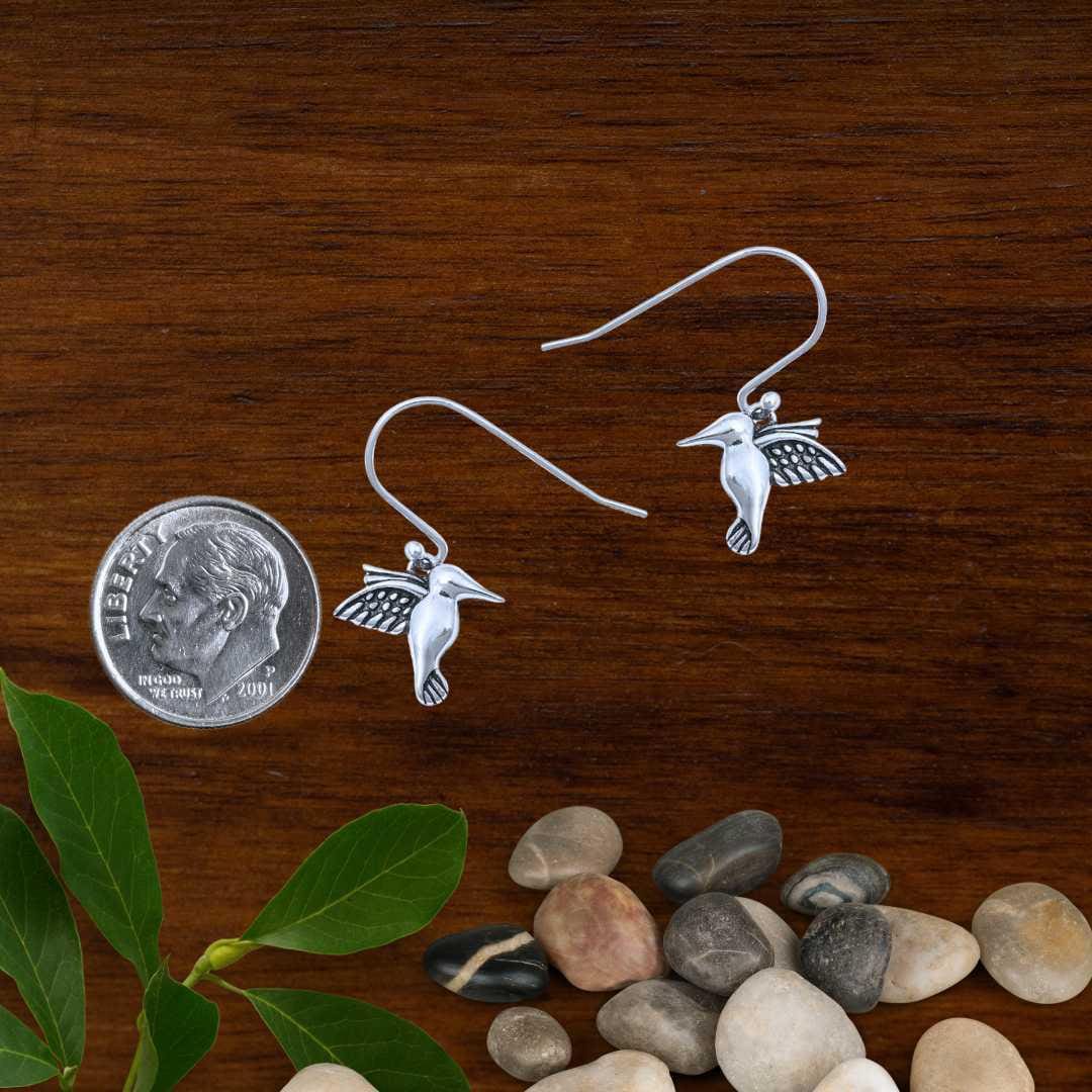 an image of a pair of Dainty Sterling Silver Hummingbird Earrings next to a dime