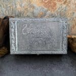 an image of a rectangular shaped hammered tin box with an elephant on the front