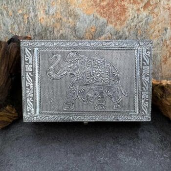 an image of a rectangular shaped hammered tin box with an elephant on the front