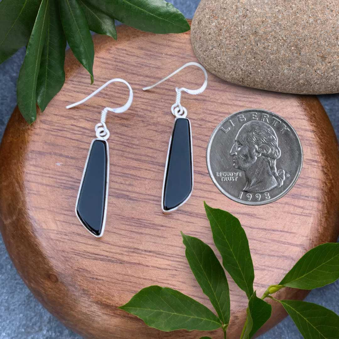 an image of a pair of Contemporary Black Onyx and Sterling Silver Earrings next to a quarter